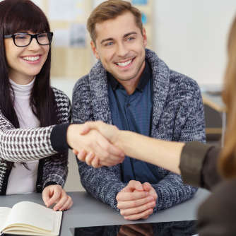 Young couple shake hands